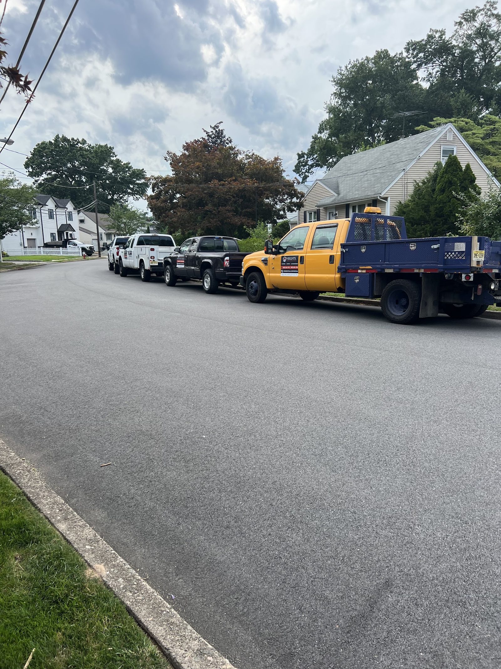 The Heights Plumbing, Heating & Cooling fleet of service trucks in New Jersey