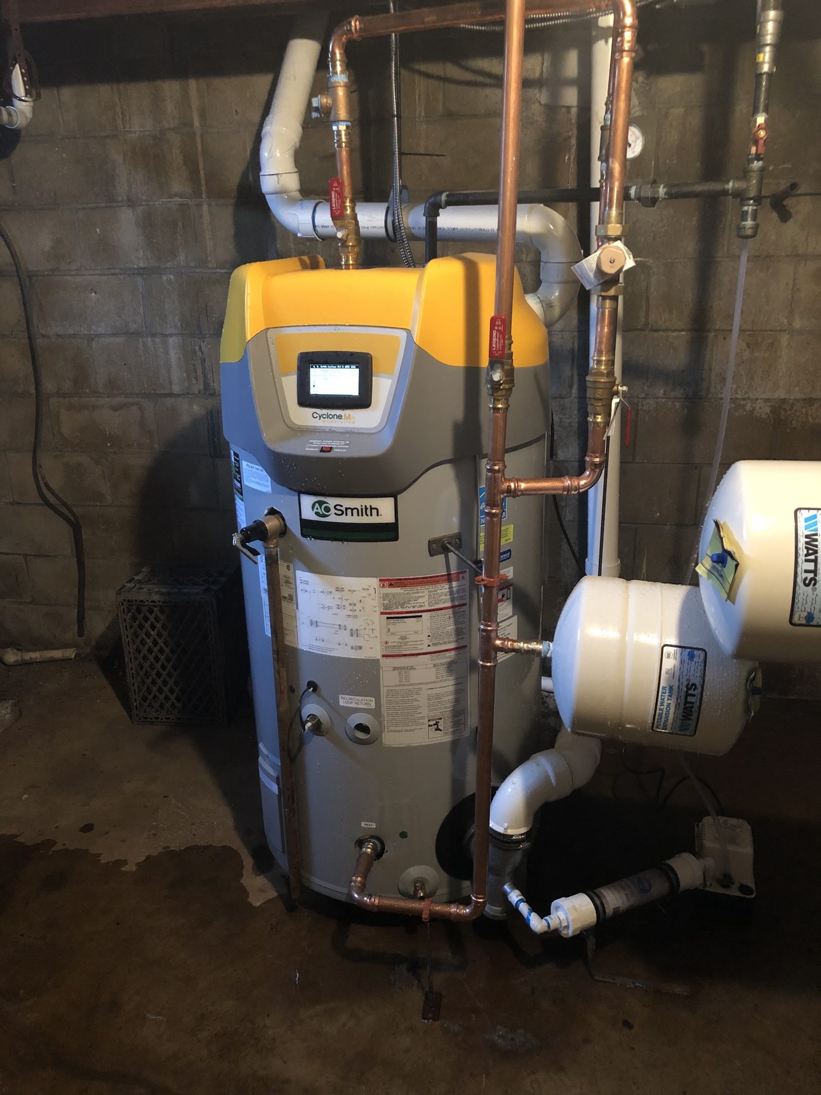 Power-vent gas water heater installation in a New Jersey basement