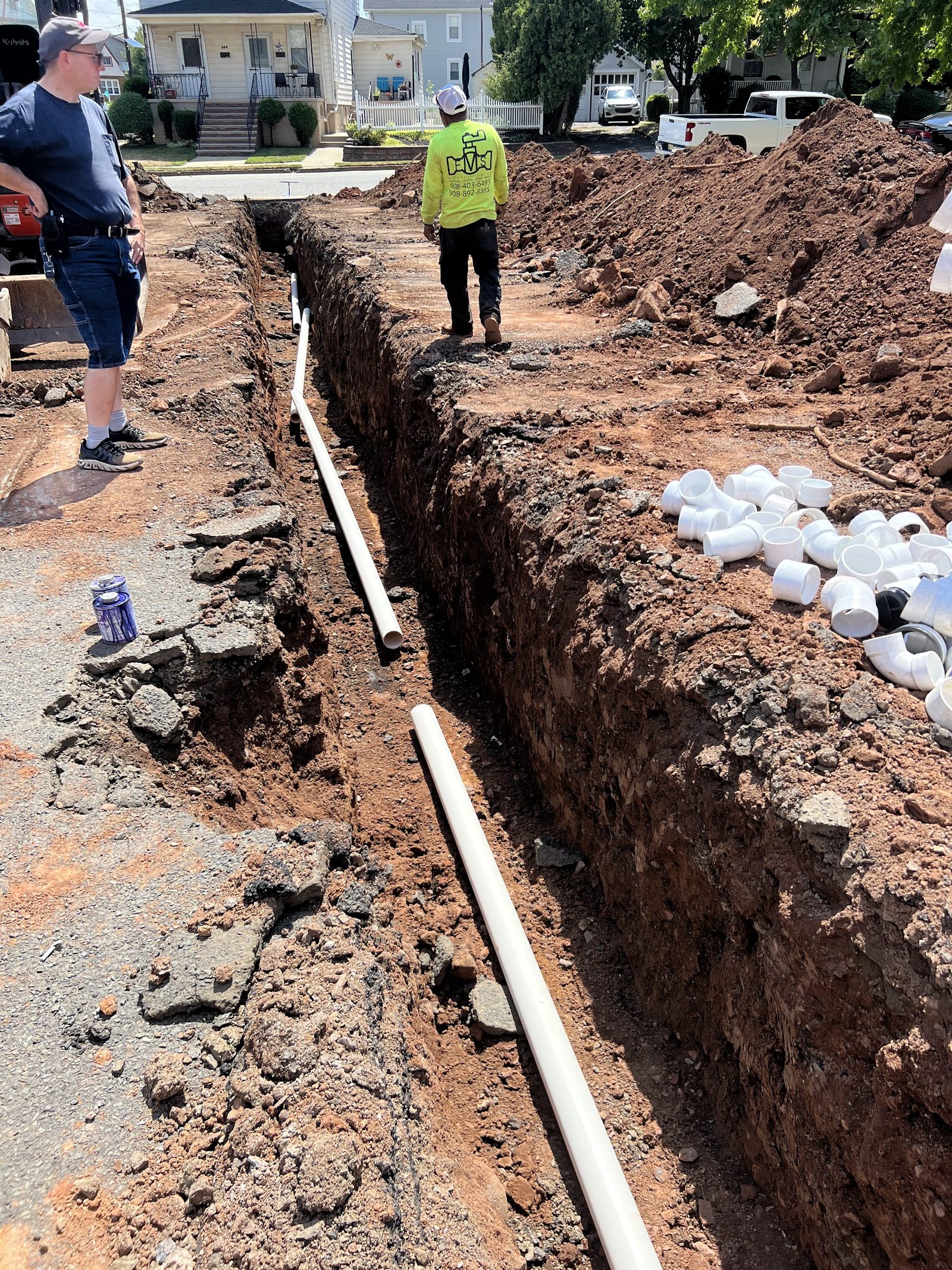 New PVC sewer line in an open trench during a sewer line replacement by Heights in New Jersey